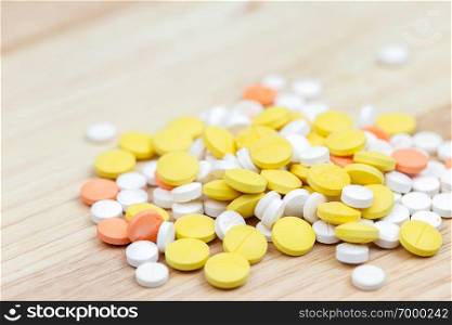 Colorful pills and drugs in close up. Assorted pills and drugs in medicine. Opioid and prescription medication addiction epidemic. Drugs of various kinds.