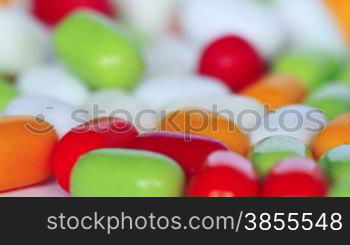 Colorful Pills Over White Background. Shot Slider.