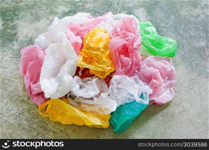 Colorful plastic bag on cement background