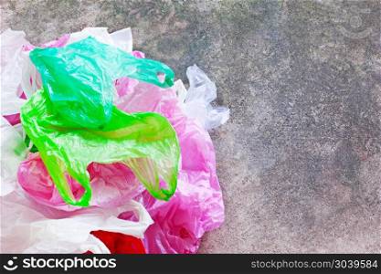 Colorful plastic bag on cement background. Colorful plastic bag on cement floor background.