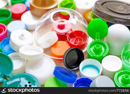 Colorful plastic bottle caps and plastic glass lid