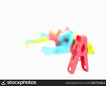 Colorful plastic clothespins isolated over white