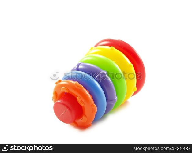 Colorful plastic pyramid toy isolated on white background