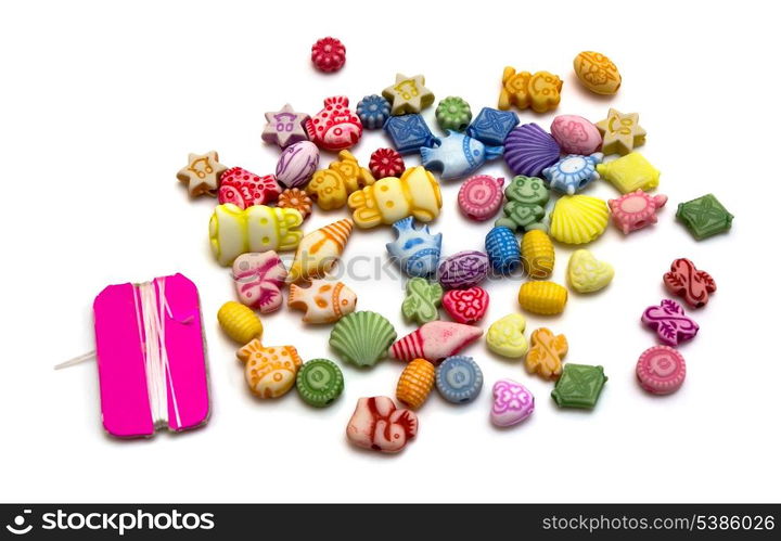 Colorful plastic toy beads isolated on white