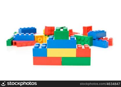 colorful plastic toys over a white background