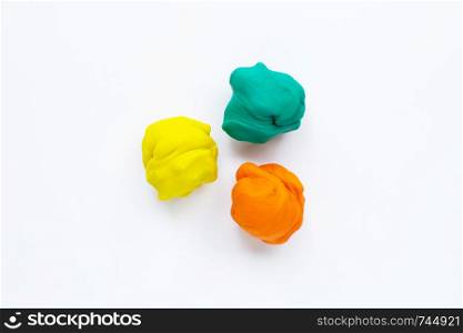 Colorful plasticine clay on white background.