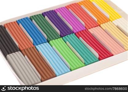 Colorful plasticine in box isolated on white