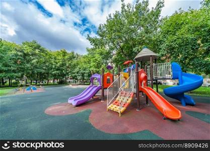 Colorful playground equipment for children in public park in summer. Colorful playground equipment