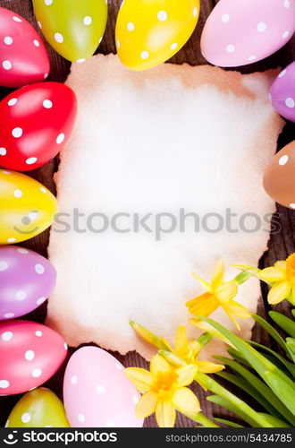 Colorful polka dot eggs and empty greeting card. Easter decorations