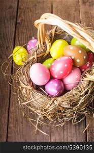 Colorful polka dot eggs in basket, Easter decorations