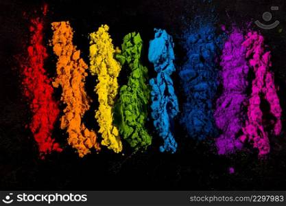 colorful powder colors arranged row black backdrop