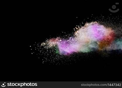 Colorful powder explosion on black background. Colored cloud. Colorful dust explode. Paint Holi.