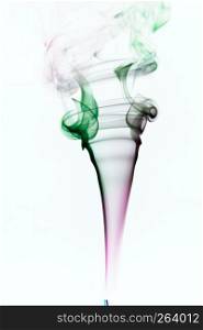 Colorful purple and green smoke of incence stick isolated at white background. Colorful smoke of incence stick isolated at white background
