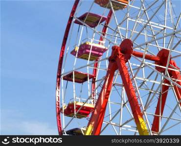 Colorful rainbow ferris wheel in amusement park