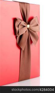 Colorful red gift with bow on white backgroud.