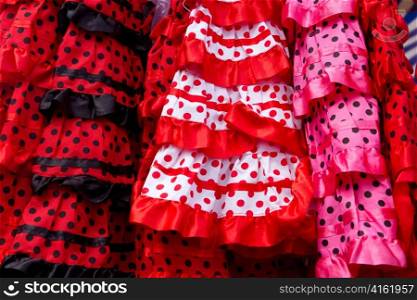 colorful red pink gipsy costumes of flamenco dancer in andalusian