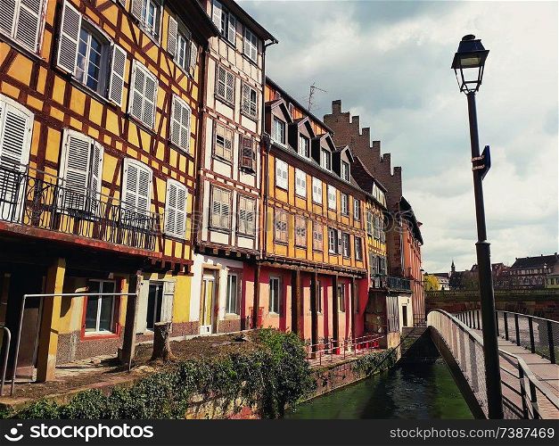 Colorful romantic city Strasbourg, France, Alsace. Traditional houses near the river. Medieval home facade, historic town. Beautiful idyllic architecture.