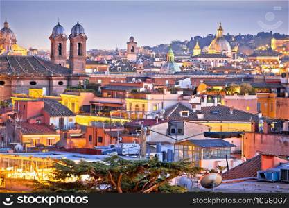 Colorful rooftops of Eternal city of Rome at dusk view, capital of Italy