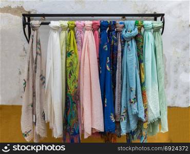 Colorful scarves on Iron Hanger in a Store