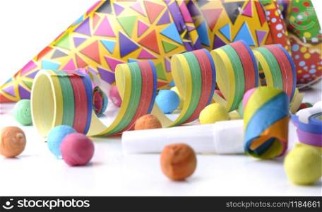 colorful serpentine and cotillons on white background