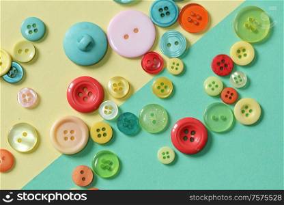 Colorful Sewing Button on Paper Background