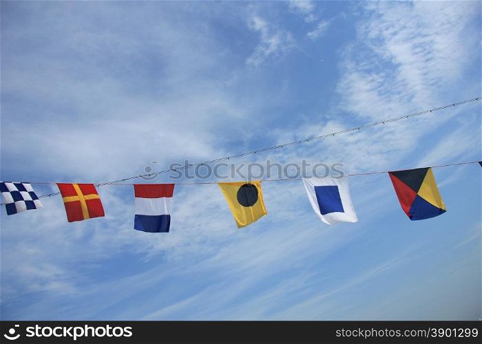Colorful signal or nautical flags on a cruise ship