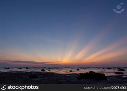 colorful sky after sunset and sun rays at the Pakarang beach, Phang Nga, Thailand