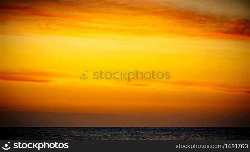 Colorful sky at sunrise over sea surface.. Sky at sunrise over sea