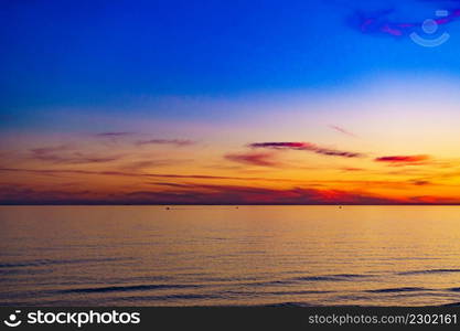 Colorful sky at sunset over sea surface.. Sky at sunset over sea