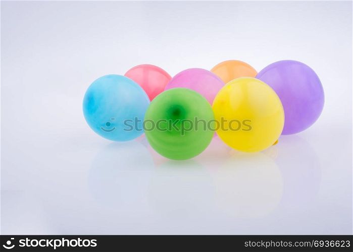 Colorful small balloons on a white background