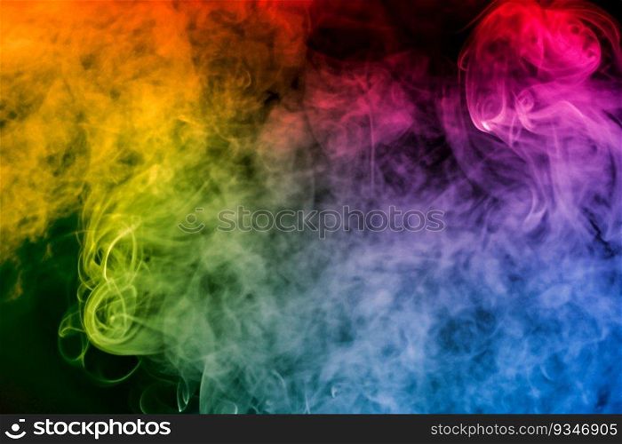 colorful smoke on dark background. artistic colorful background