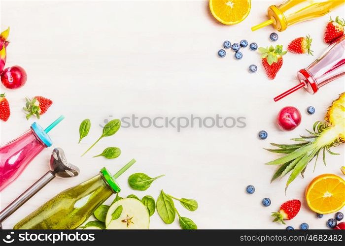 Colorful smoothies : green, pink, yellow and red with ingredients for Healthy eating , detox or diet food concept on White wooden background, Top view, frame