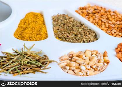 colorful spices are in the palette closeup