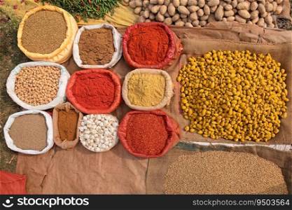 Colorful spices displayed in an informal rural outdoor market, India 