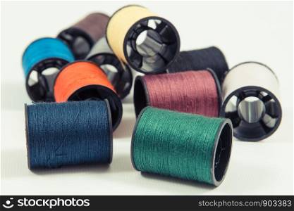 Colorful spools of thread. Accessories for needlework or sewing. Colorful spools of thread. Accessories for needlework