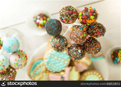 Colorful sprinkles on chocolate cake pops