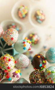 Colorful sprinkles on chocolate cake pops