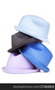 Colorful stack of modern hats. Isolated over white background