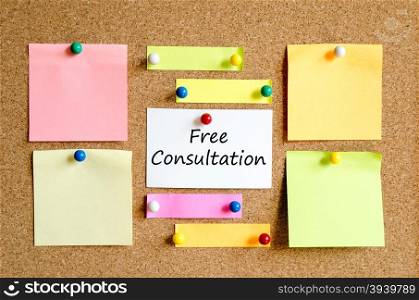 Colorful sticky notes on cork board background and text concept free consultation