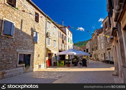Colorful stone streets of Stari Grad, island of Hvar ancient architecture, Croatia