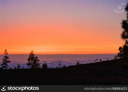 Colorful sunset at La Palma with a view over the low-hanging clouds