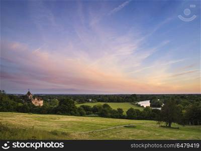 Colorful sunset landscape over fields and River Thames on Richmo. Landscapes. Sunset landscape over fields and River Thames on Richmond Hill in London.