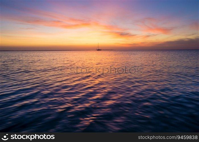 Colorful sunset over ocean on tropical island