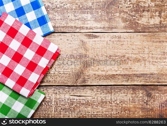 colorful tableclothes on old wooden table