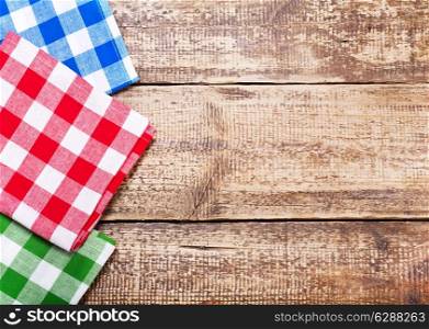 colorful tableclothes on old wooden table