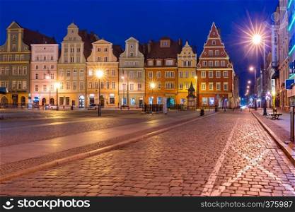 Colorful tenements on Market Square during morning blue hour in the Old Town of Wroclaw, Poland. Market Square in Wroclaw, Poland