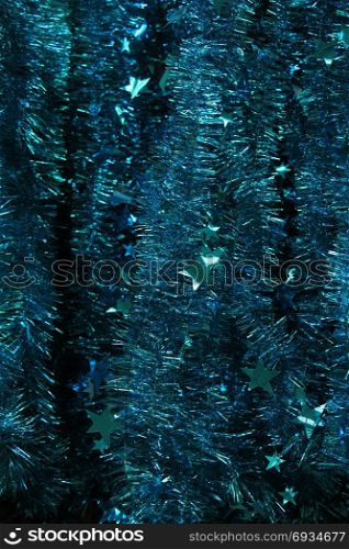 Colorful tinsel garlands in a christmas retail shop