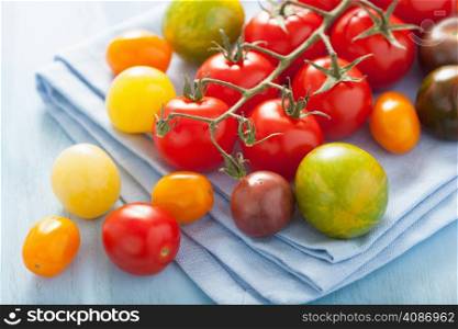 colorful tomatoes over blue napkin