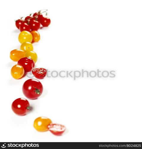 colorful tomatoes over white background
