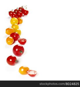 colorful tomatoes over white background